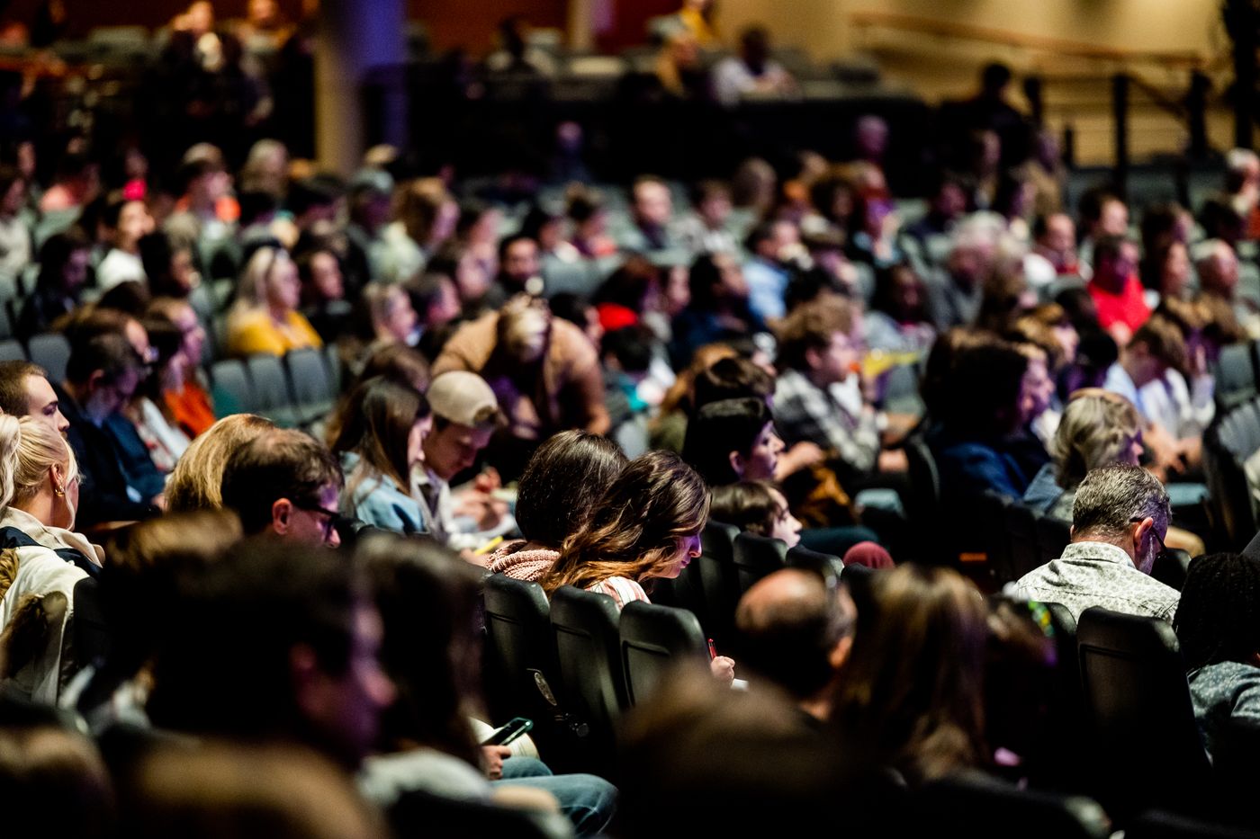 A packed conference audience